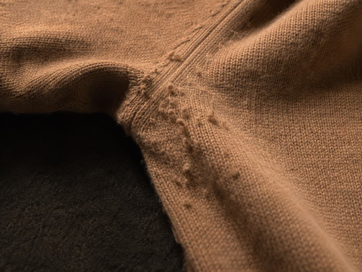 Underarm friction zone of a chunky lambswool sweater