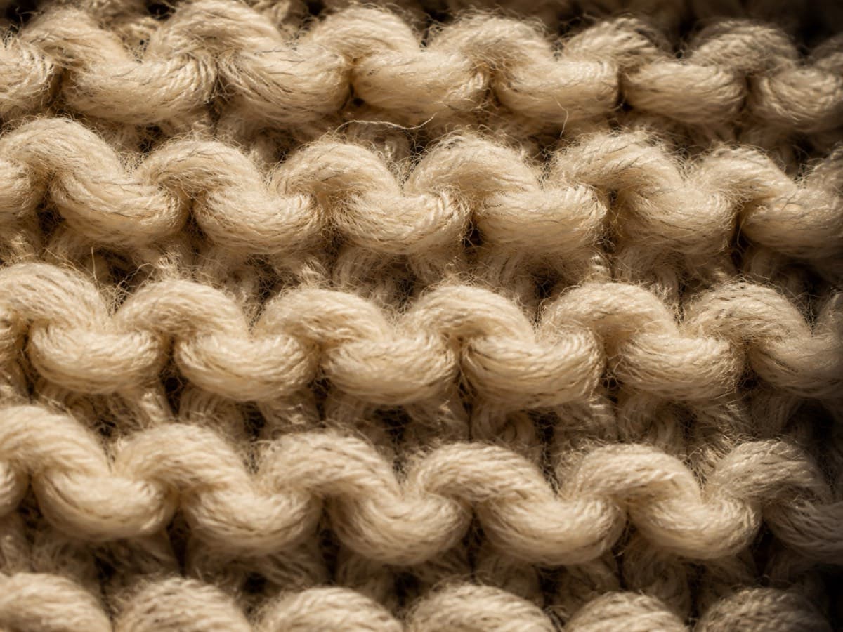 Macro of chunky lofty lambswool knitting