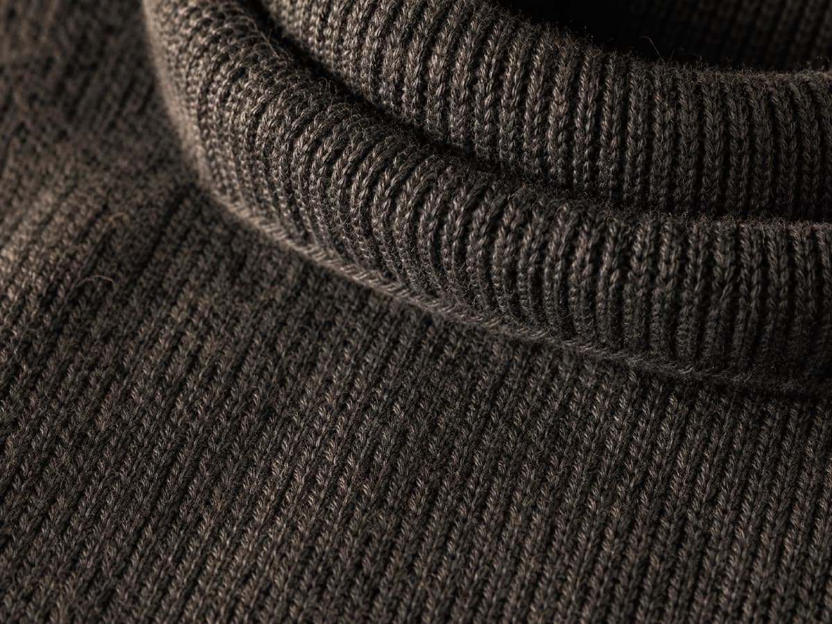 Macro of a folded merino turtleneck collar edge