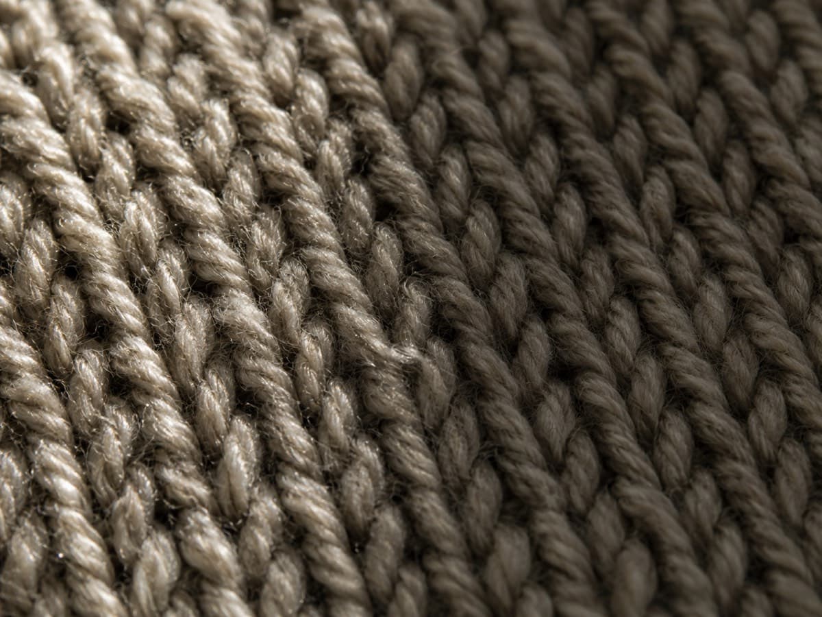 Macro of wool-silk blend stockinette with a faint sheen