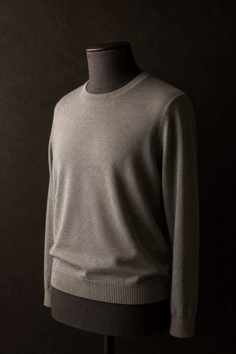 Fine dove grey merino crew neck on a charcoal dress form