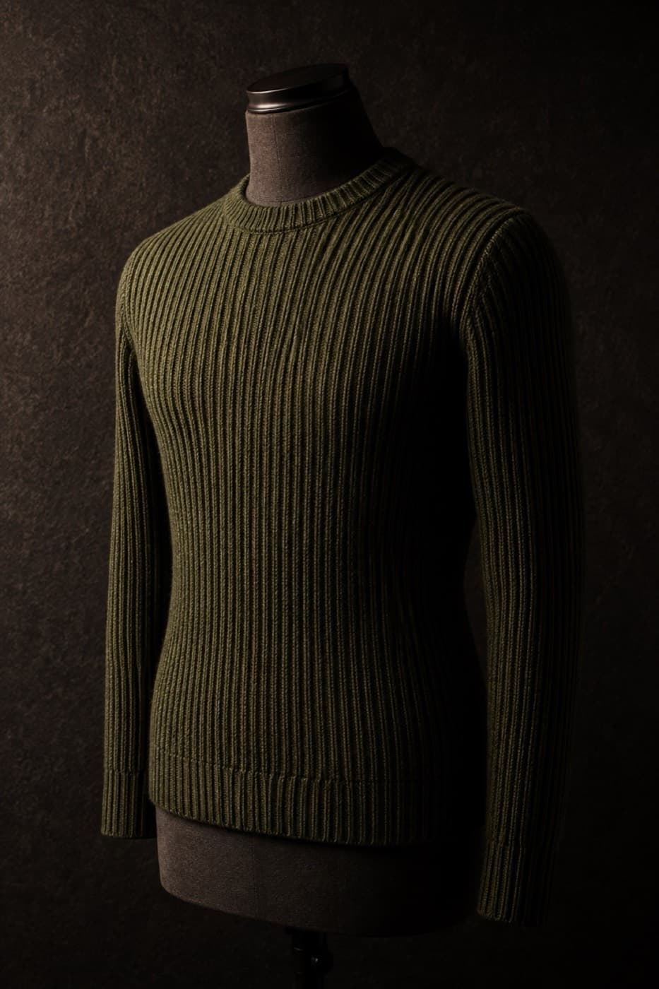 Moss green ribbed merino crew neck on a charcoal dress form