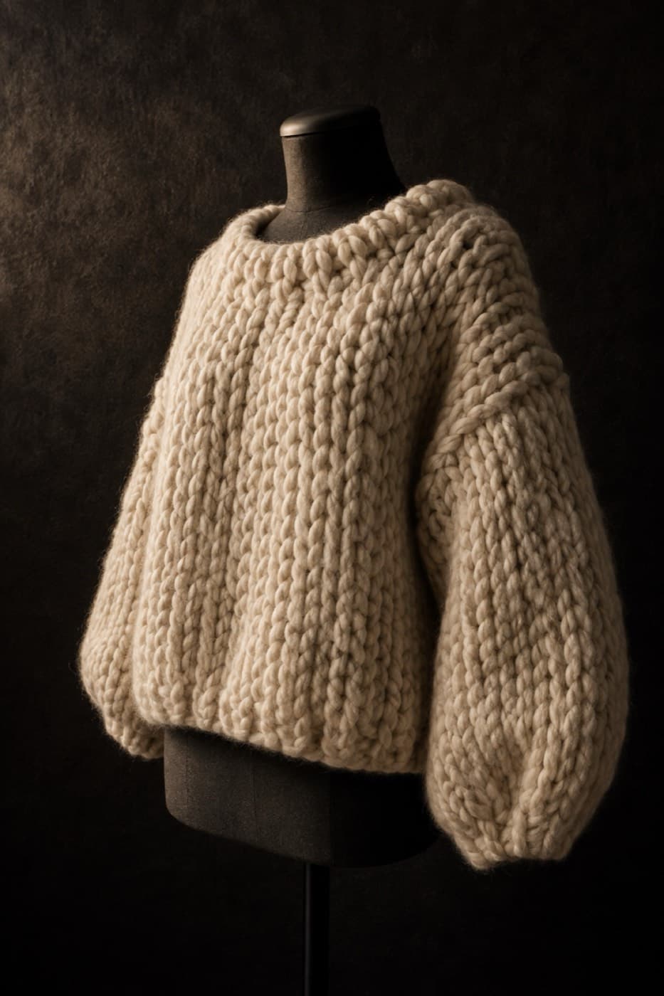 Ecru chunky four-ply merino sweater on a charcoal dress form