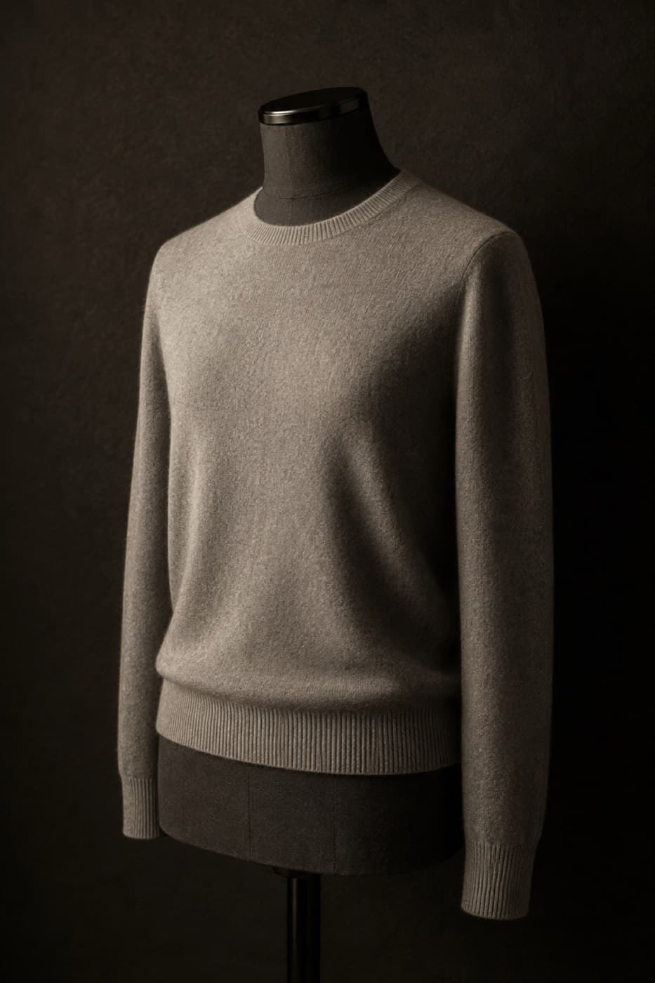 Dove grey pure cashmere crew neck on a charcoal dress form