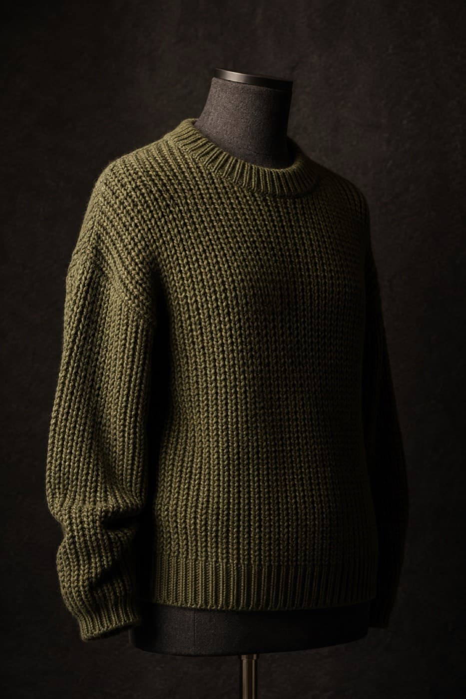 Moss green chunky cotton sweater on a charcoal dress form