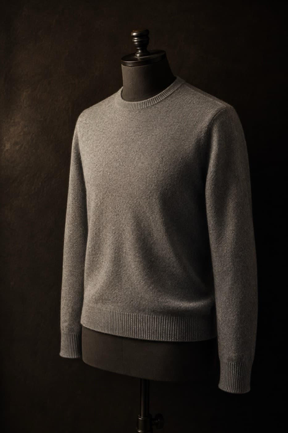 Soft grey 85% merino, 15% cashmere crew neck on a charcoal dress form